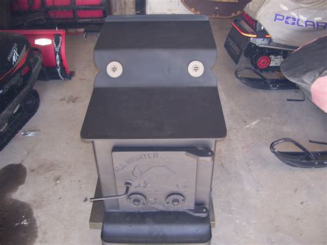 Dual controls on heavy cast iron door that is a symbol of quality with the All nighter Moe de. . All nighter wood stove